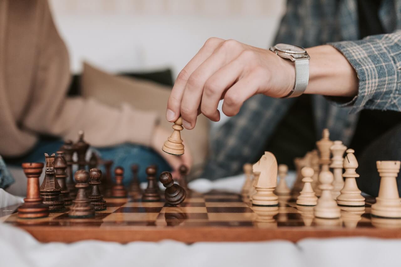 A competitor making move in chess