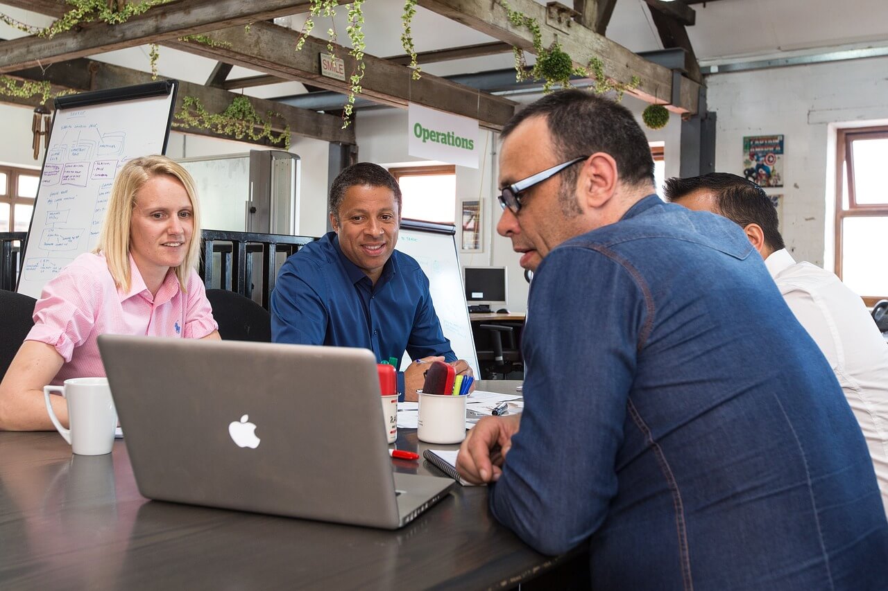 Coworkers having a virtual meeting with their boss