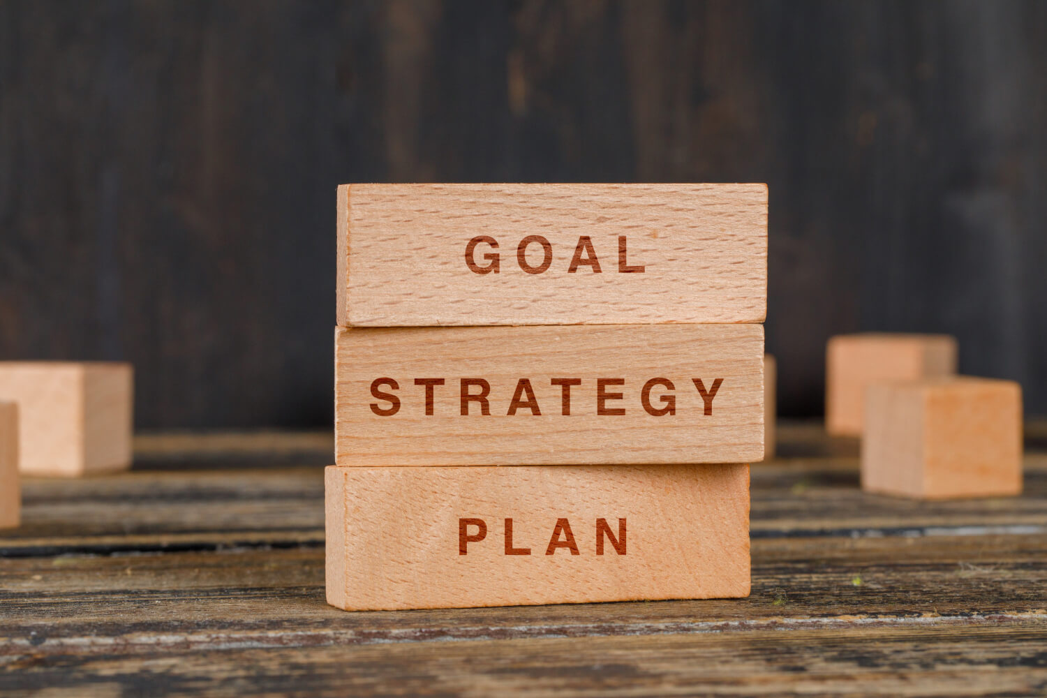 Stacked wooden blocks illustrating a strategy plan