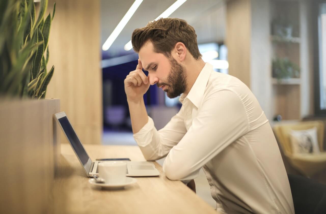 A businessman trying to resolve a work problem