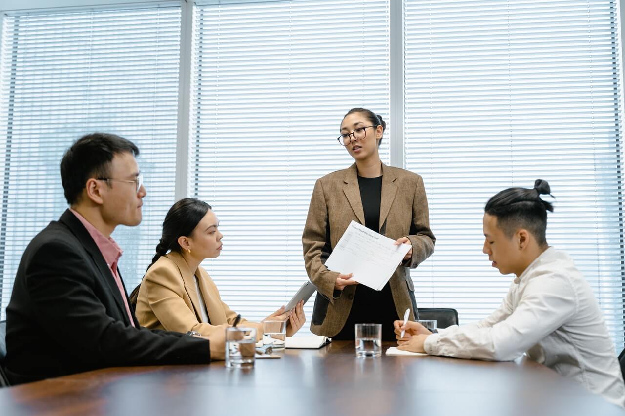 Business men and women in a business meeting