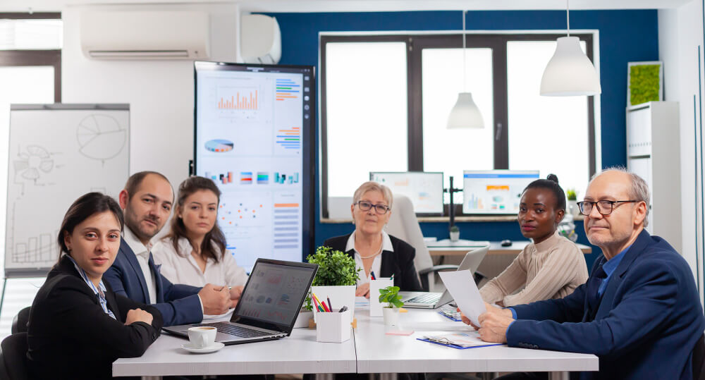 Board meeting of business executives in a conference room