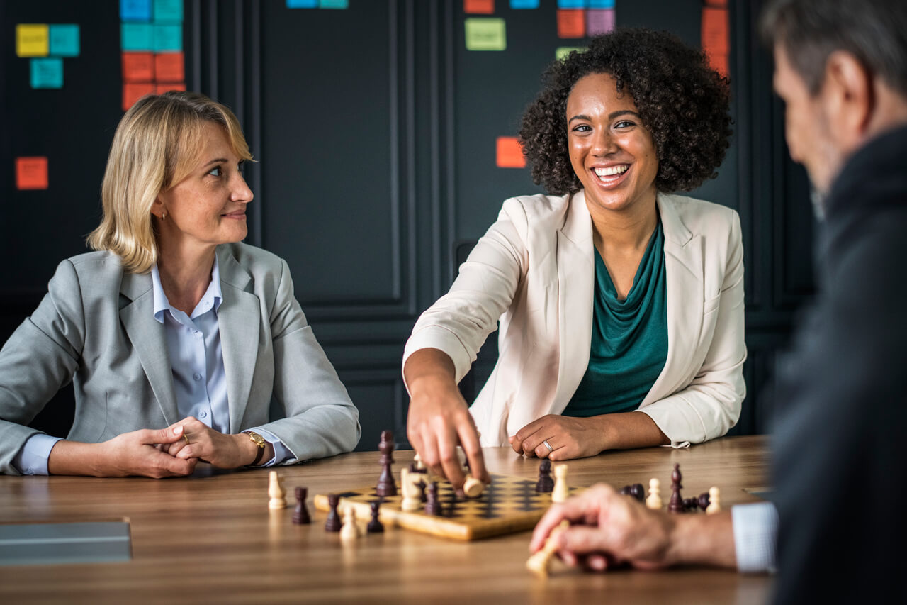 Work colleagues playing a game of chess