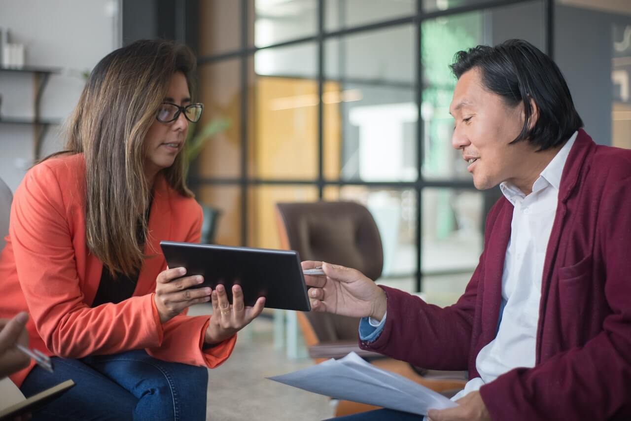 Workplace colleagues discussing work