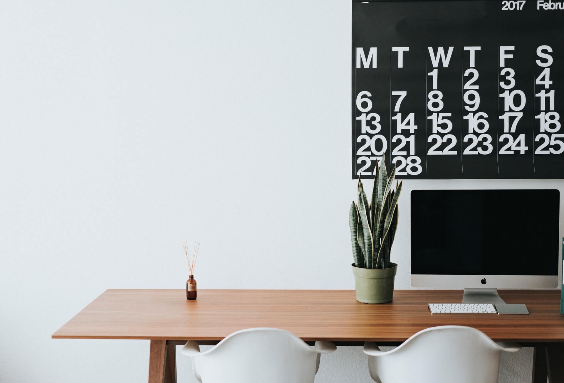 Desktop on a brown wooden desk