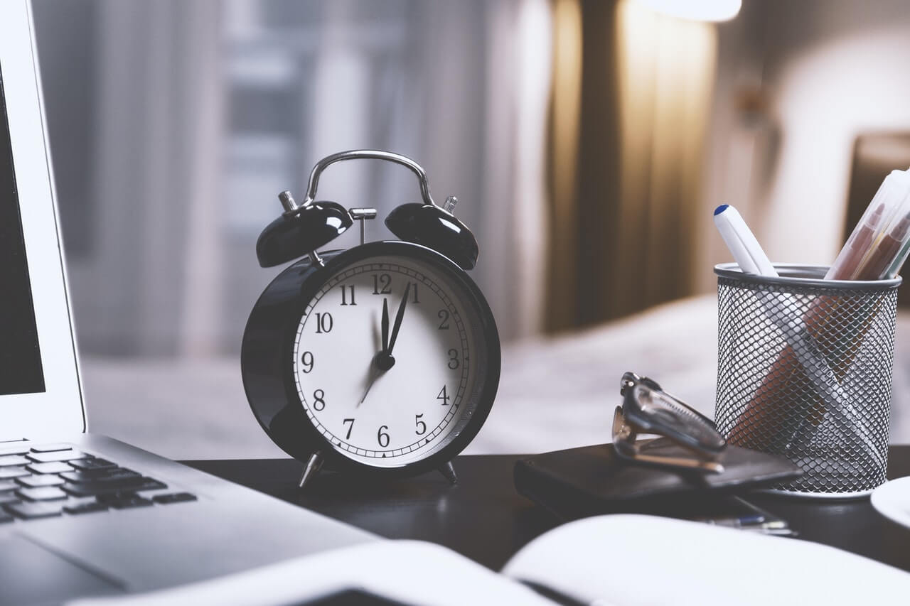 Alarm desk clock in a workspace