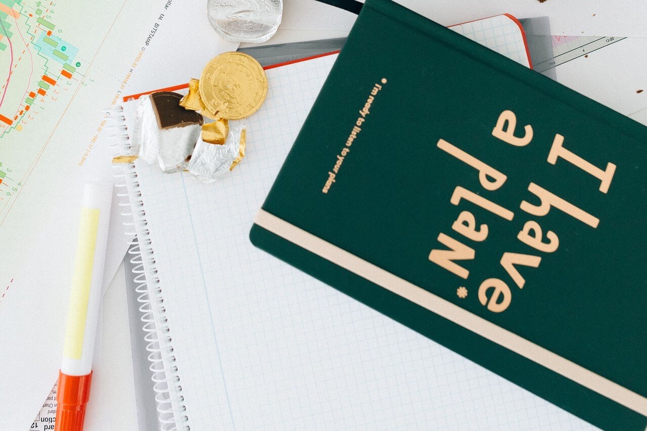 Green planning book on an office desk