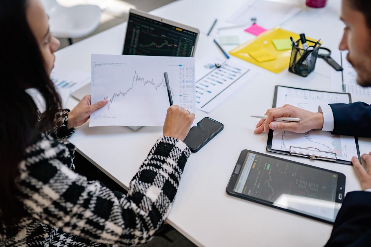 People in office studying a graph