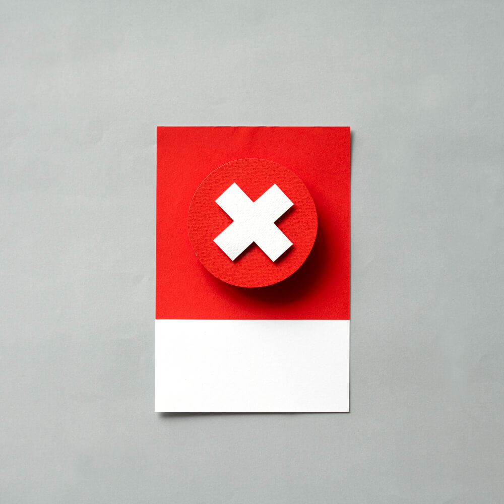 White x on a red paper