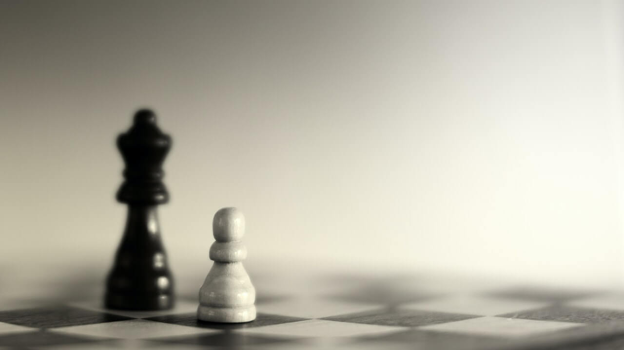 Two different chess pieces on a board