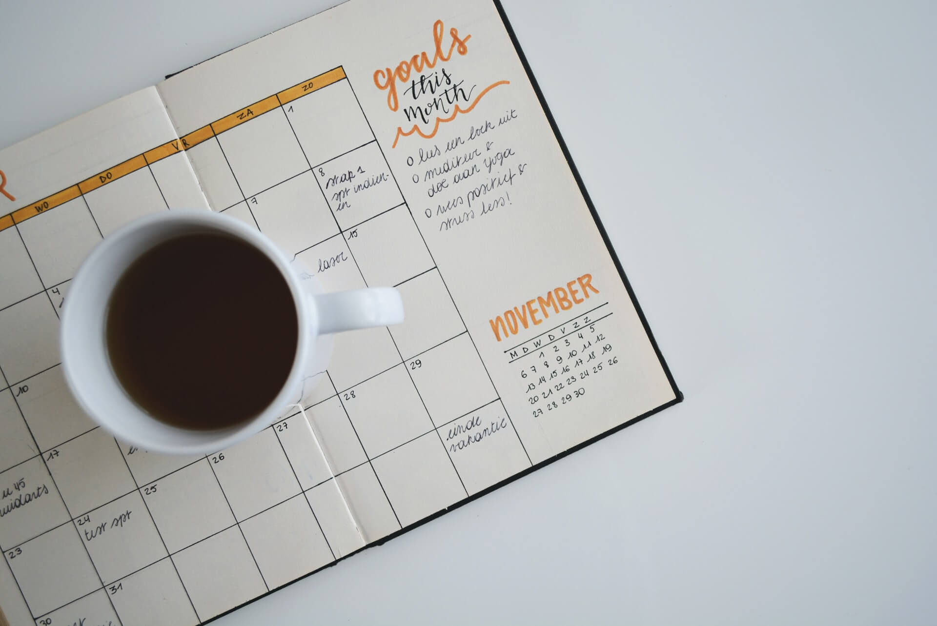 Coffee mug on top of a planner