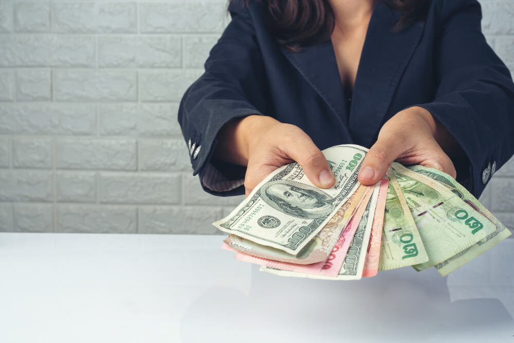 Woman in suit counting money