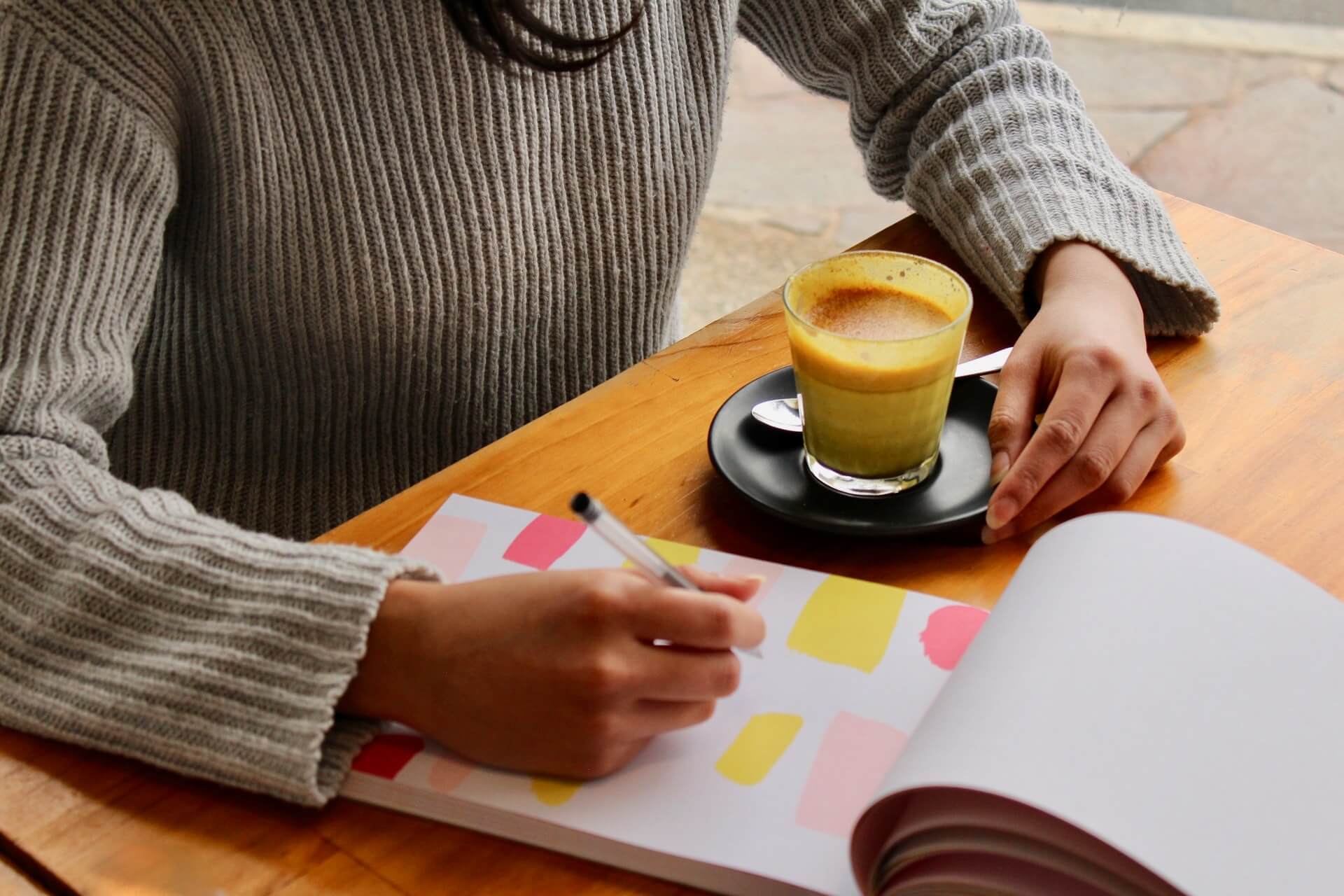 Person writing on a notepad