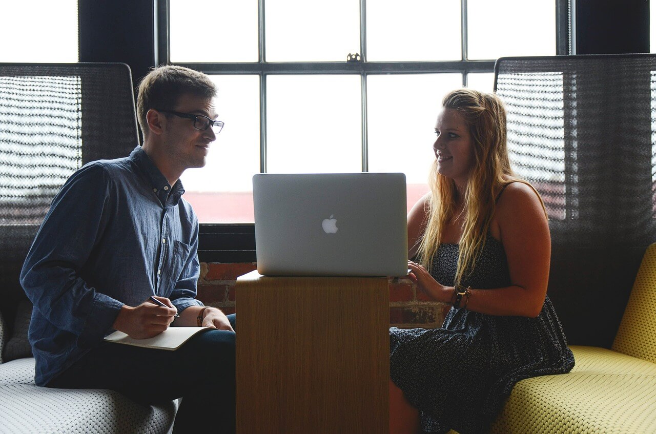 Representatives of two nonprofits discussing about the details of their joint fundraiser