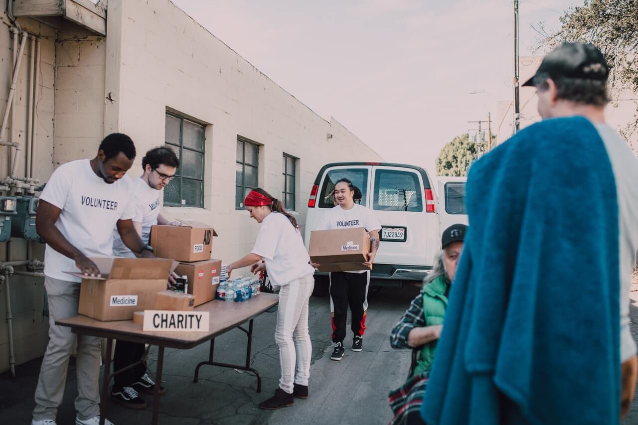 Group of volunteers sorting in-kind donations