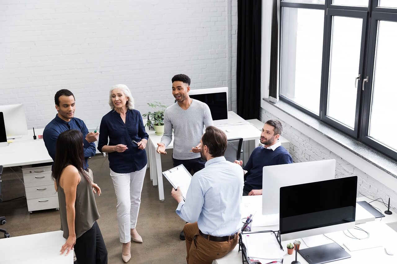 A development officer chatting with their team