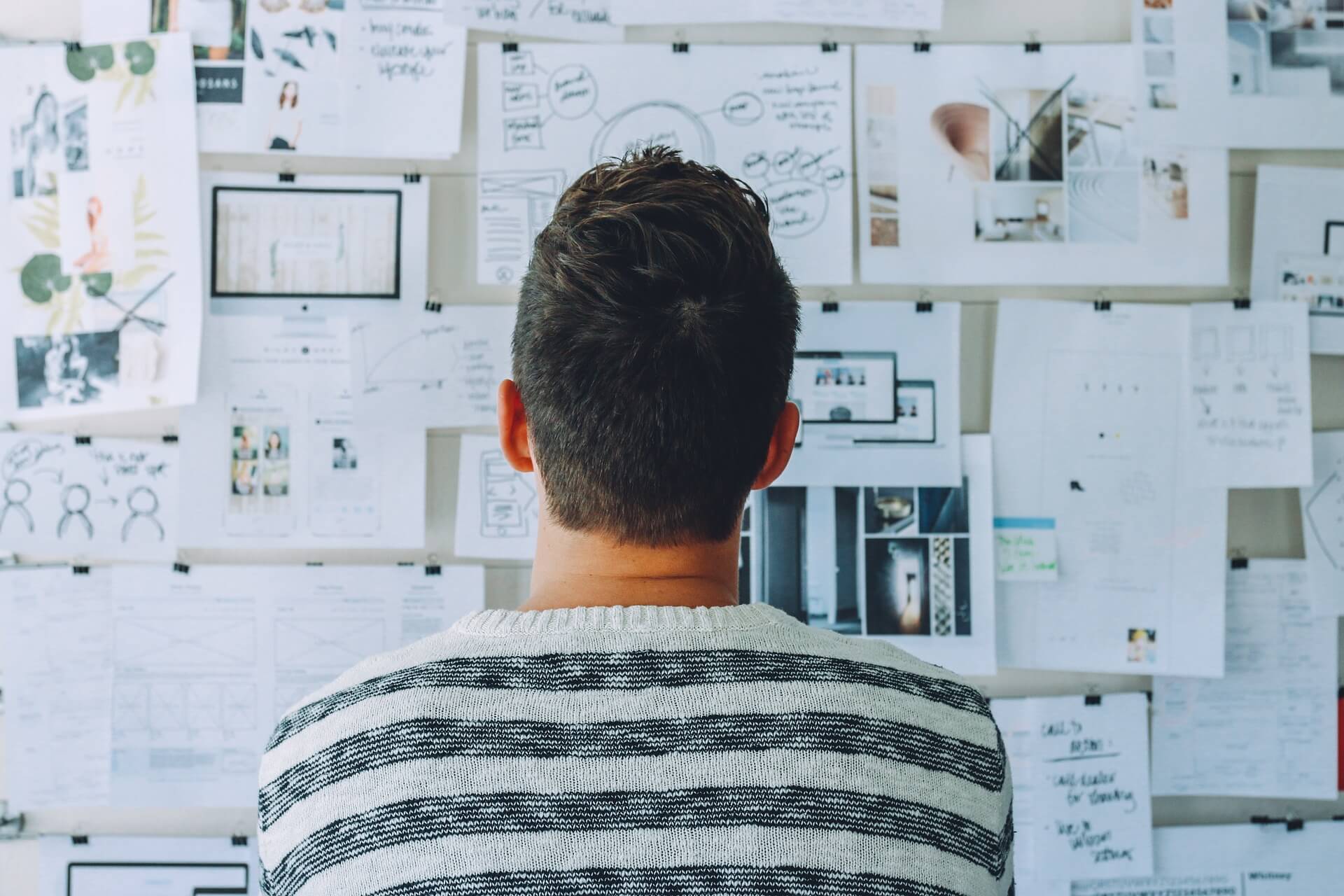 Man mapping out a strategic plan on a board