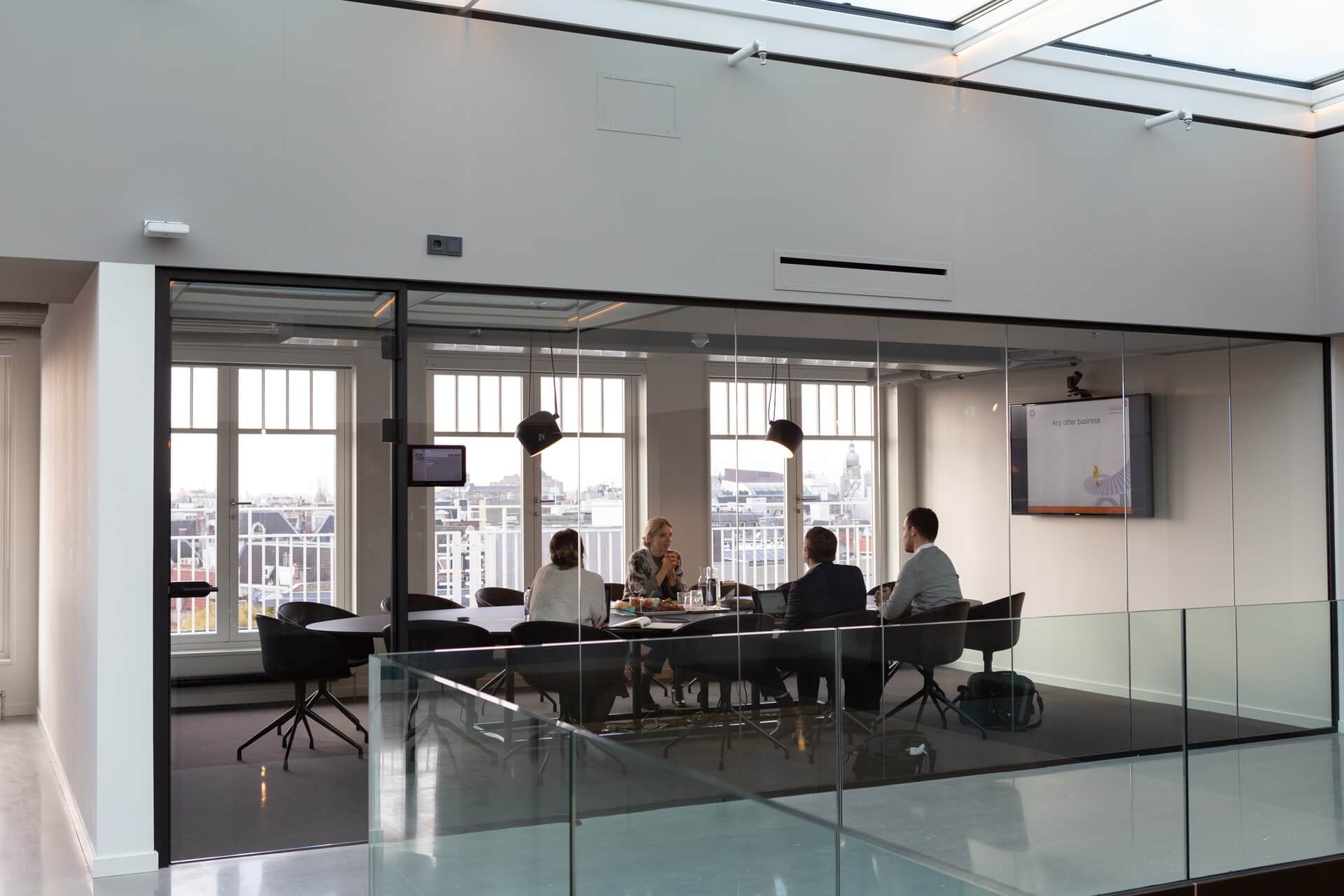 A group of colleagues having a business meeting in a meeting room