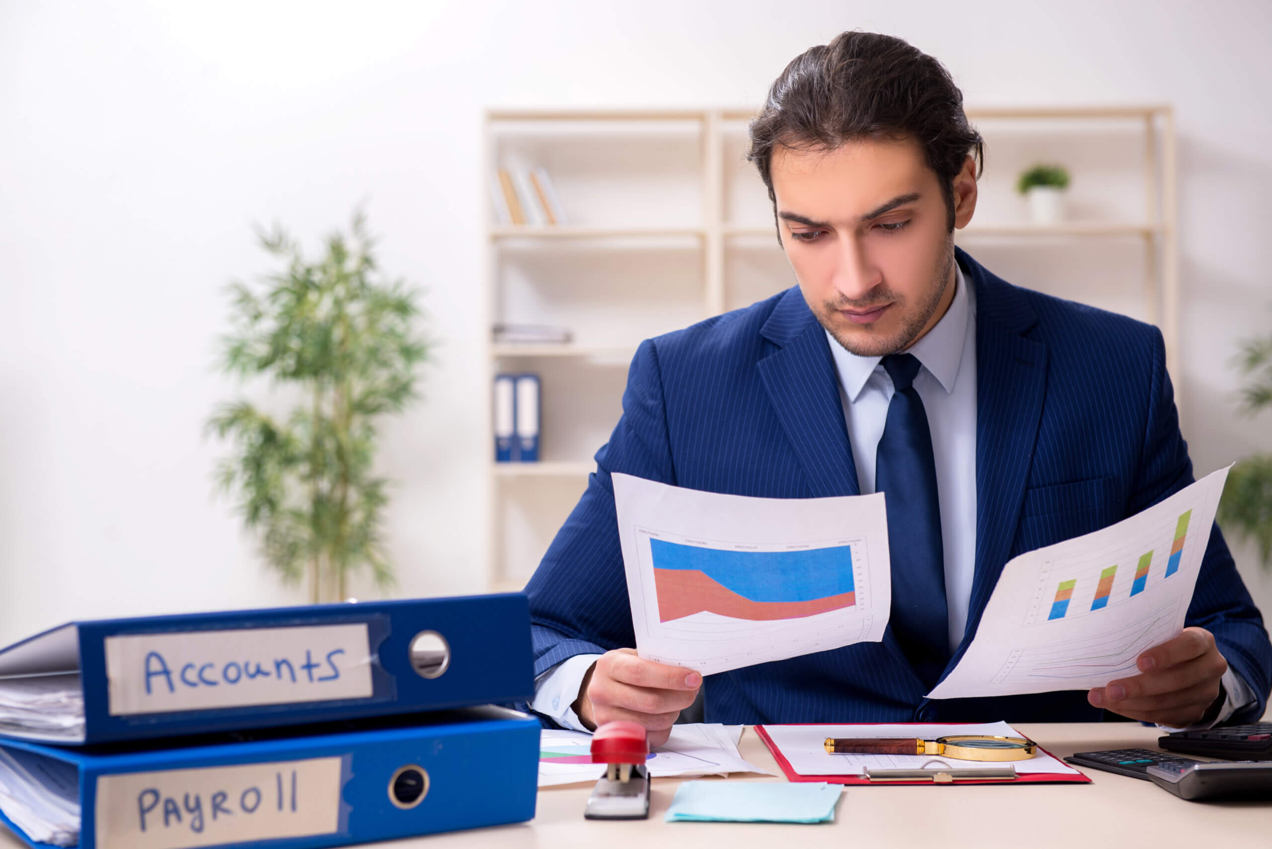 Young male financial manager in the office