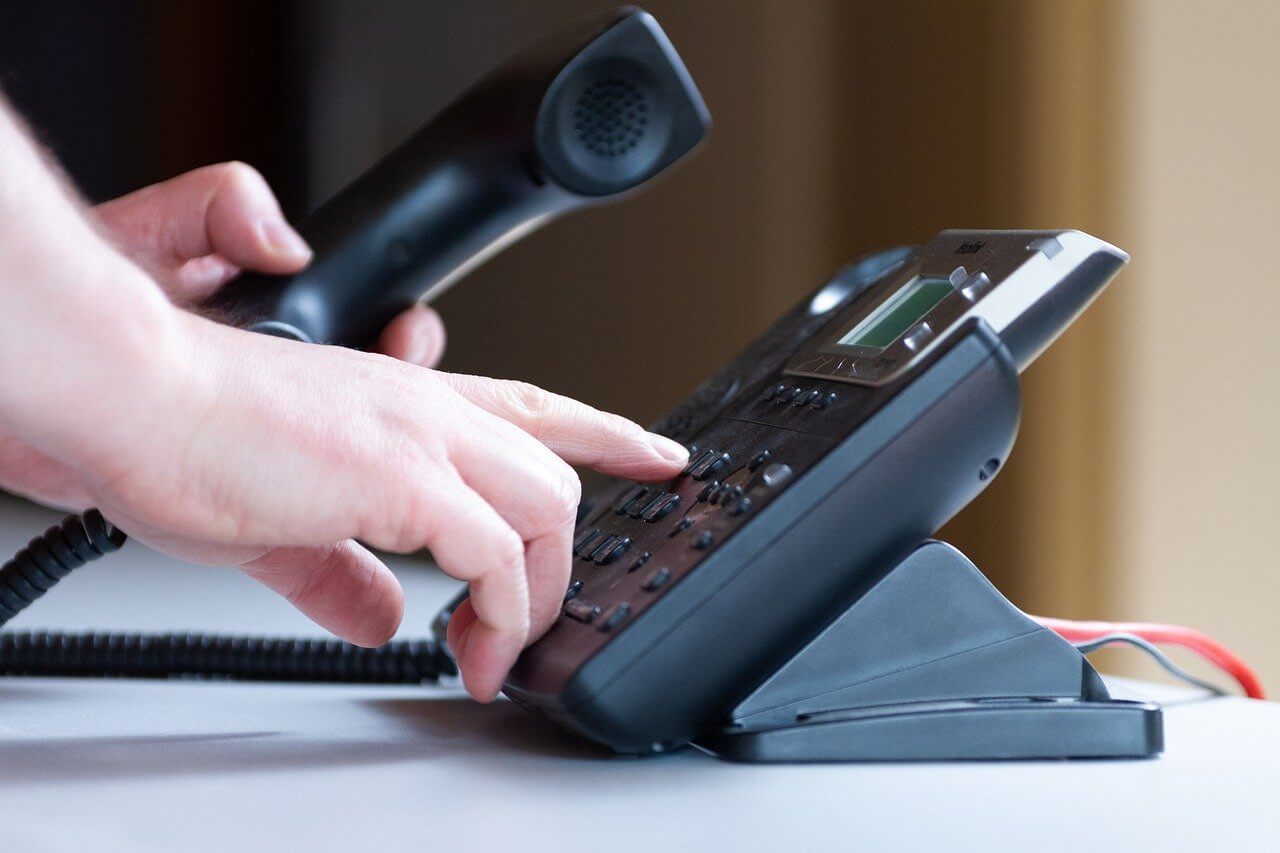 Nonprofit representative dialing a potential donor's number