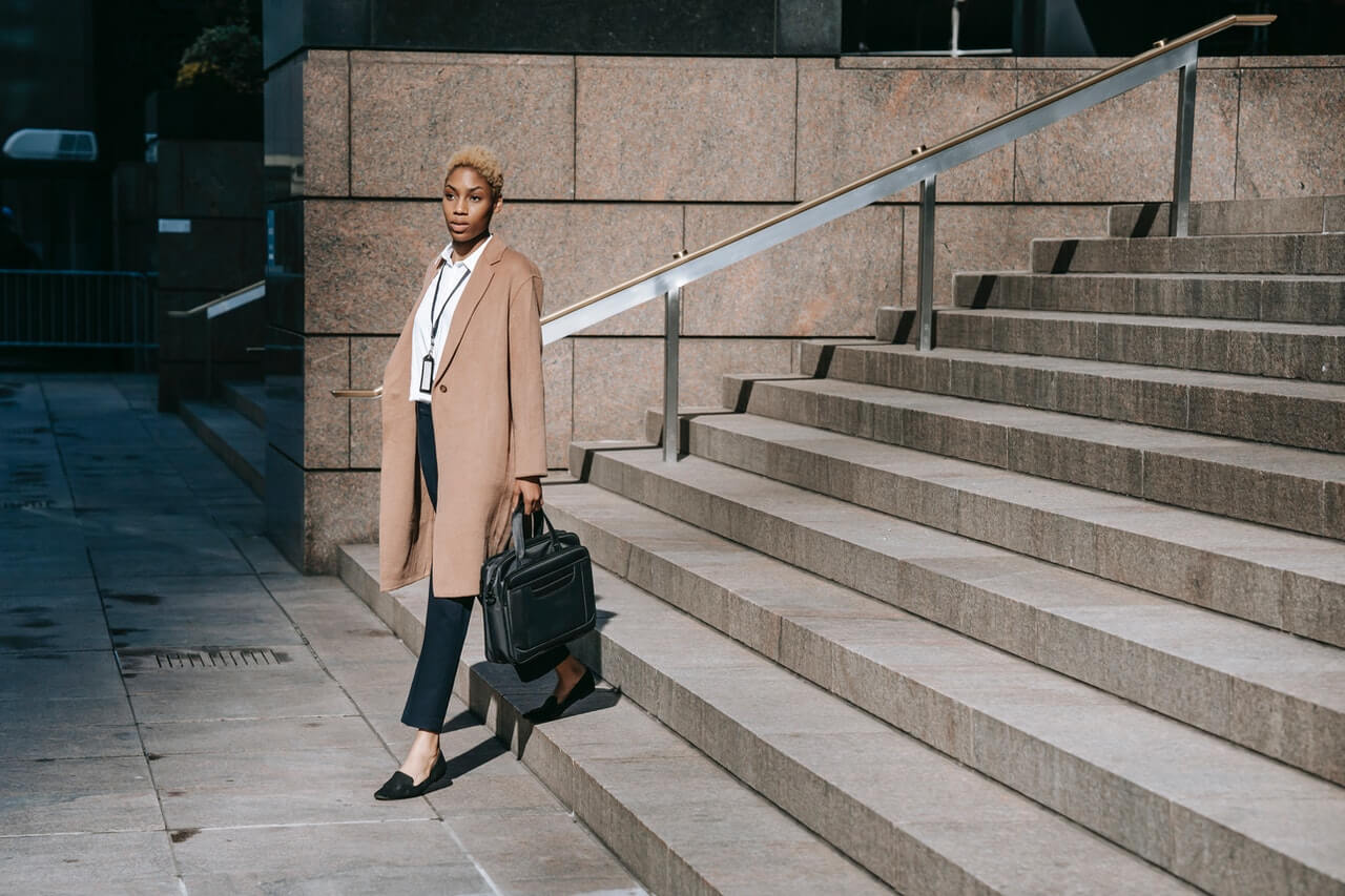 Businesswoman going down a stairs