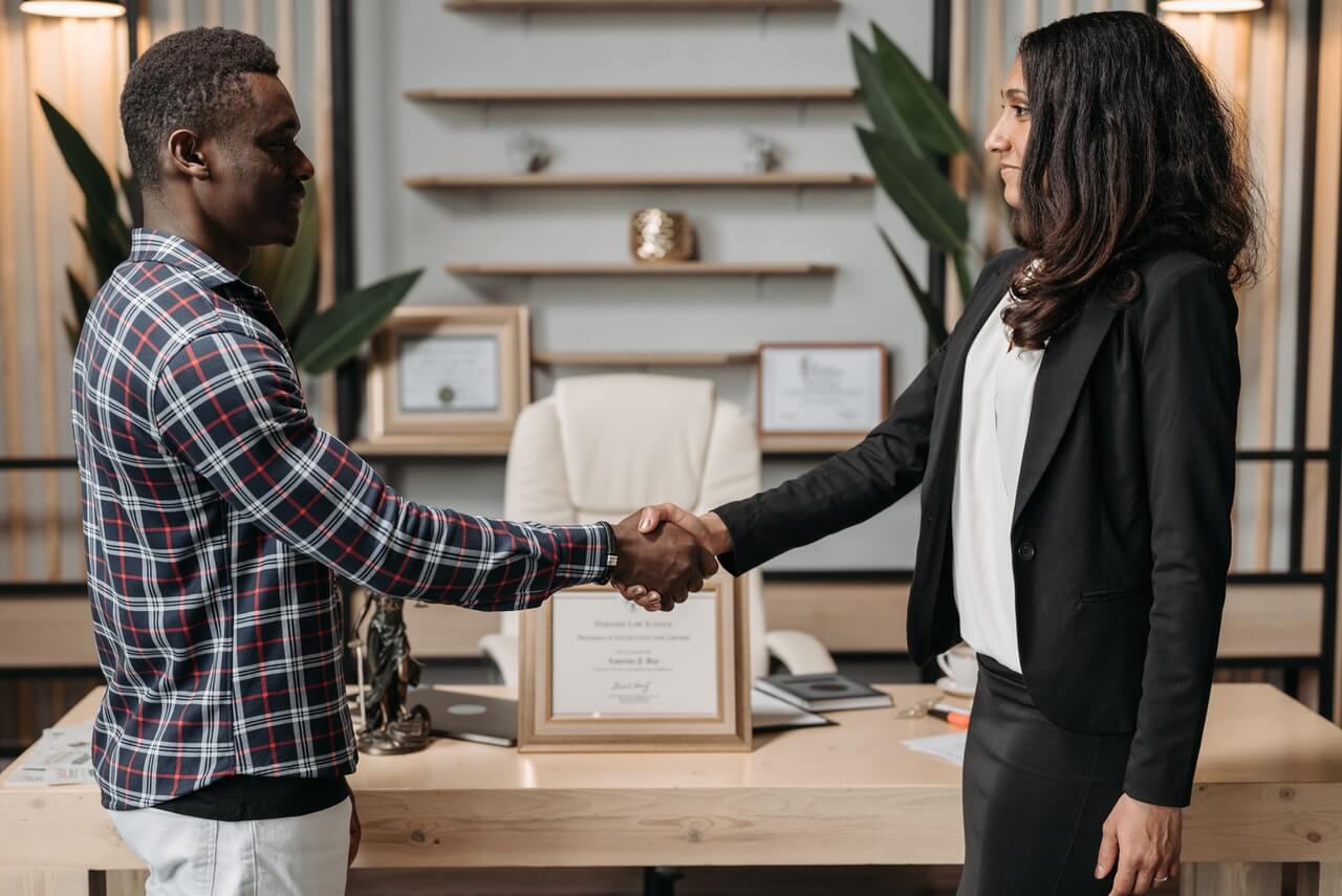 A Professional Fund Raiser shaking hands with a Fundraising Professional