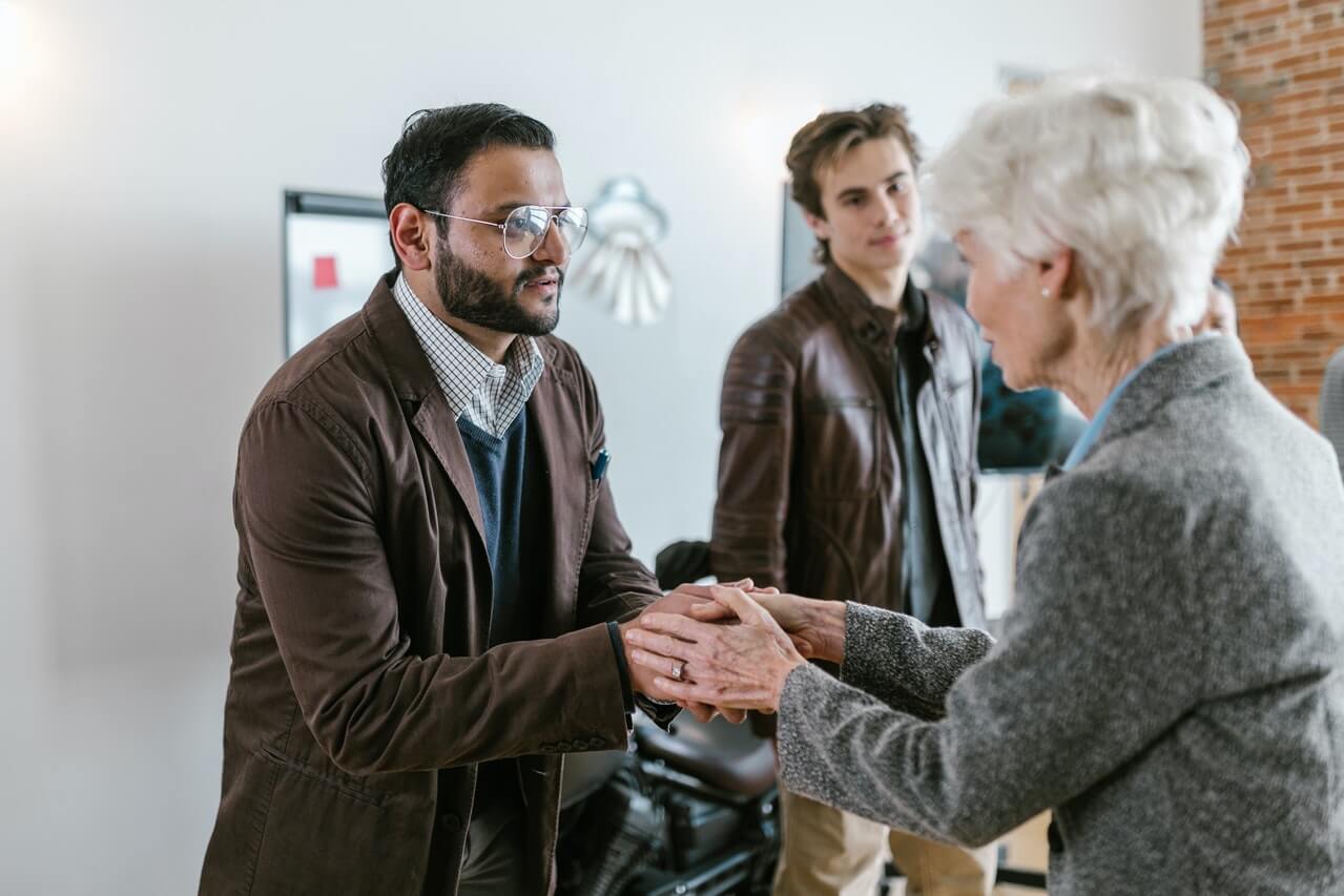 a volunteer with workers in an organization.