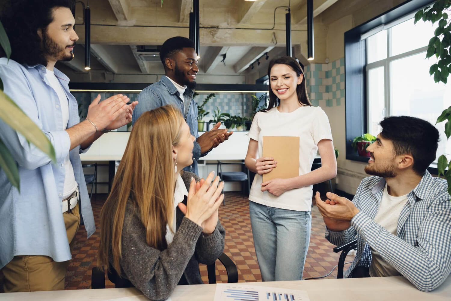 colleagues-applauding-the-performance-of-a-hardworking-staff