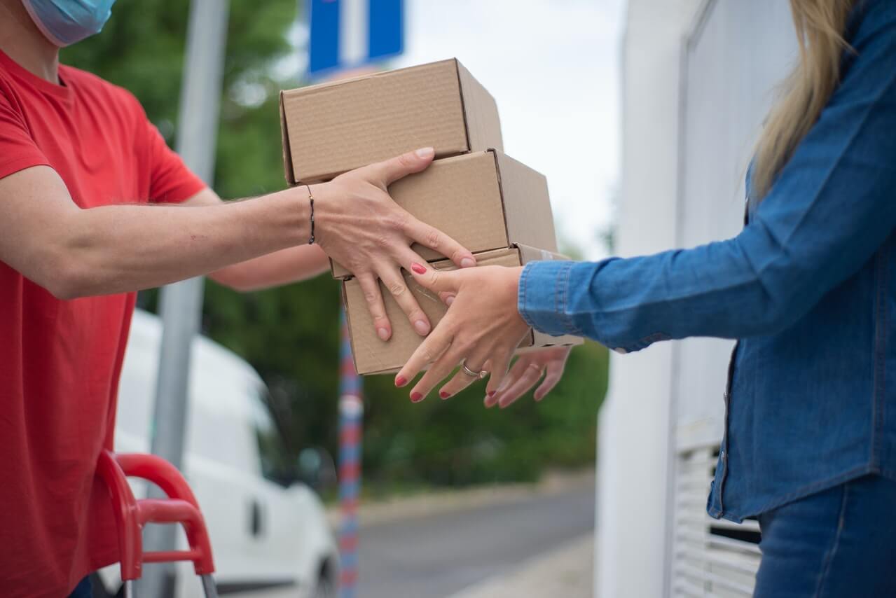 someone-receiving-a-gift-box-from-a-donor