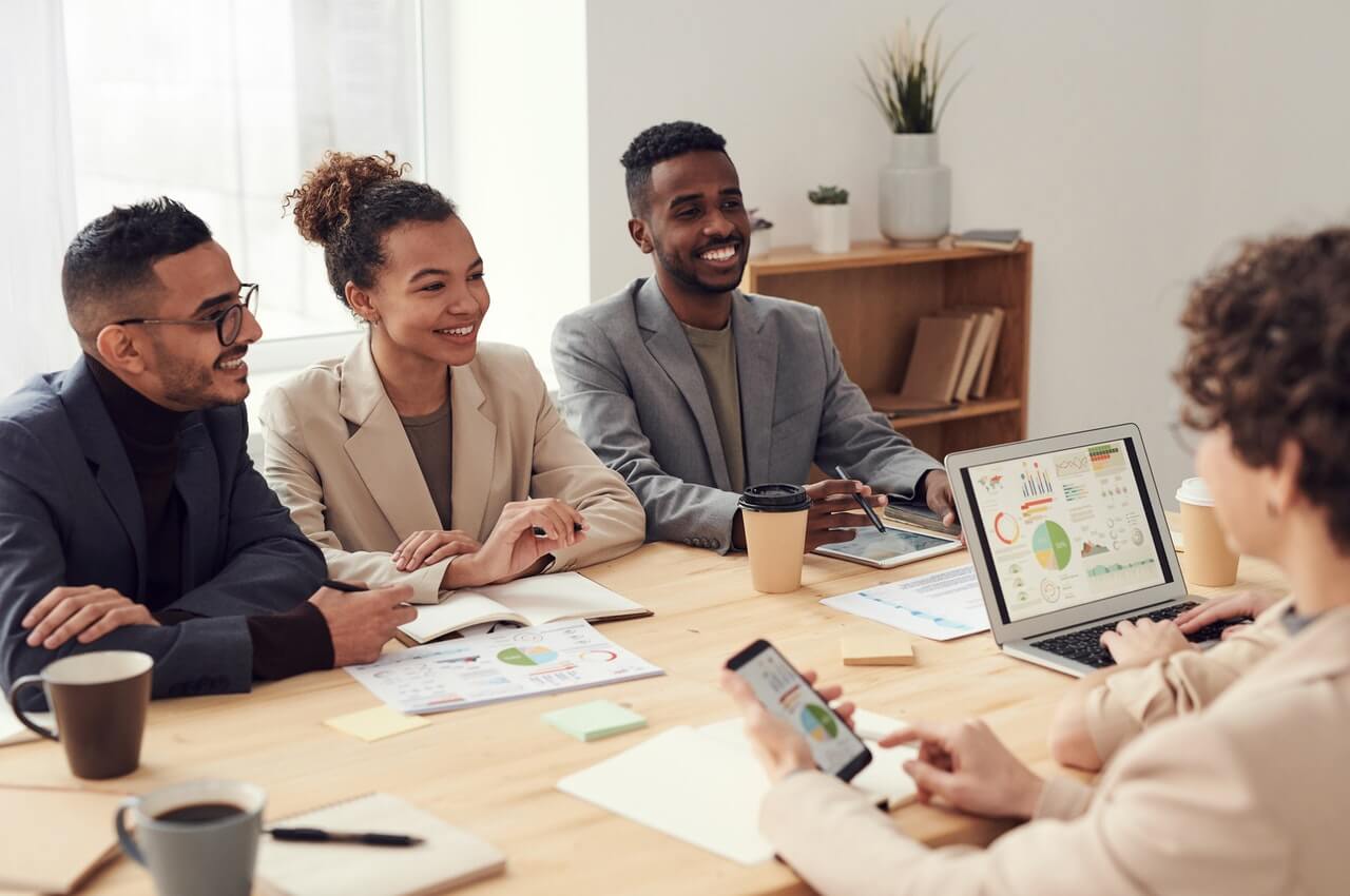 A-female-HR-staff-having-a-discussion-with-emplolyees-in-her-office