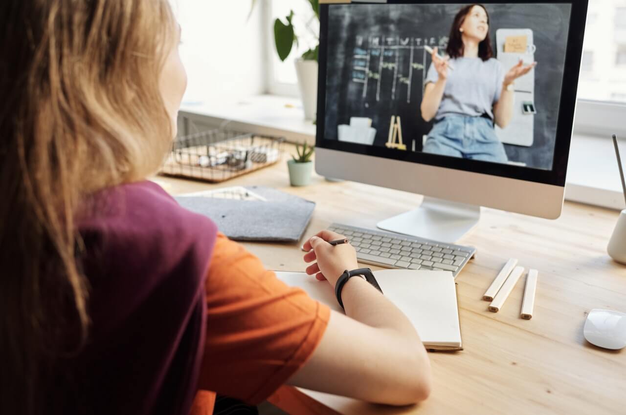 A-person-watching-a-trainng-program-with-her-computer.