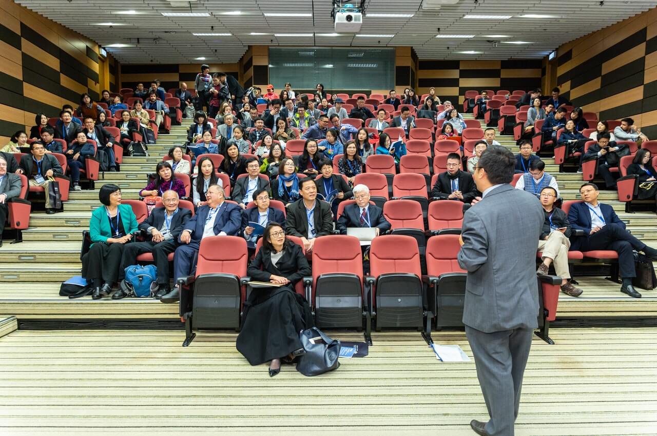 A-presenter-in-front-of-a-group-of-people-in-a-business-seminar