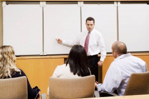 A-trainer-teaching-with-a-white-board-paper