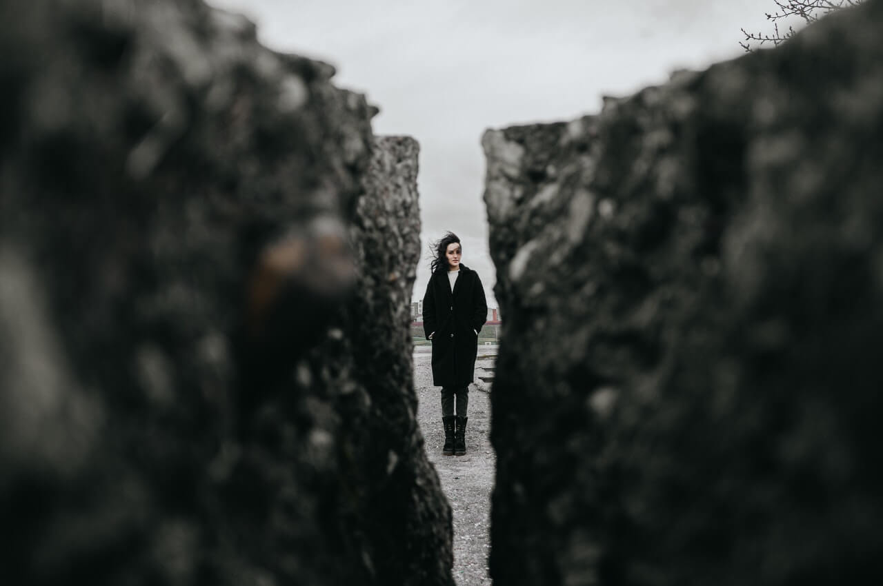 A-woman-standing-in-between-rocks