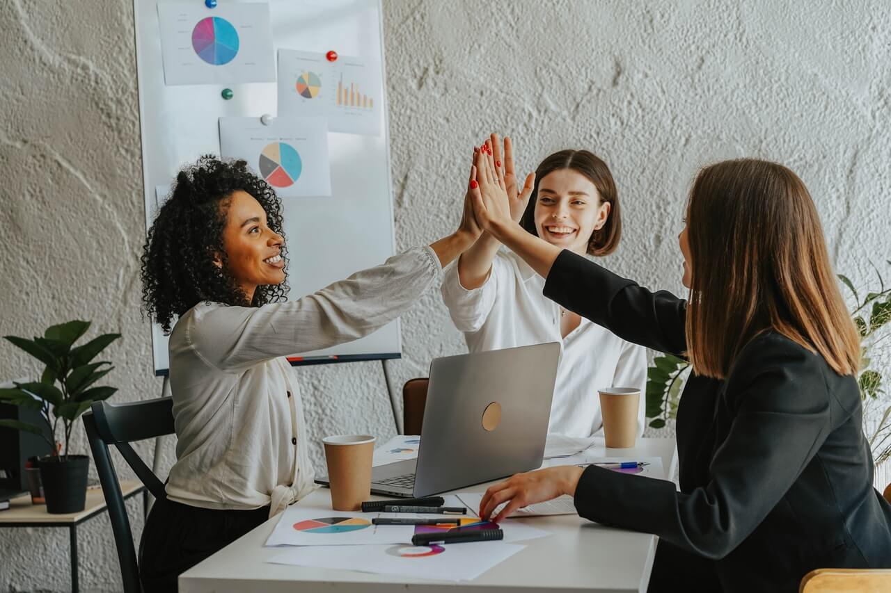 Colleagues-having-a-group-handshake-in-an-office