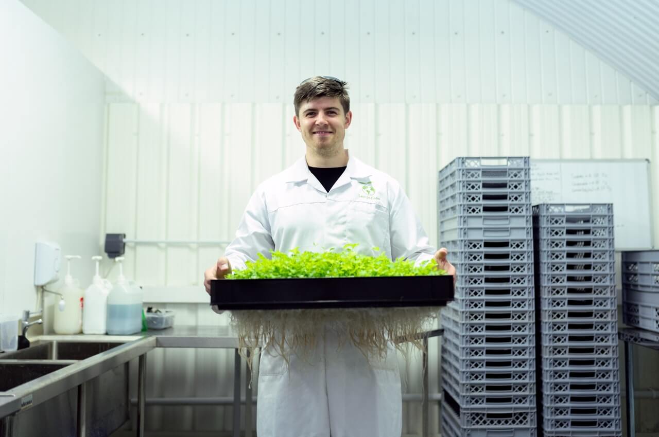 Scientist-holding-a-plant-in-a-laboratory.