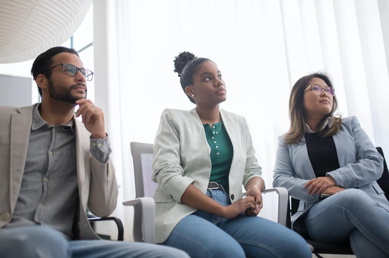 Staffs-in-an-organization-listening-to-a-speaker.