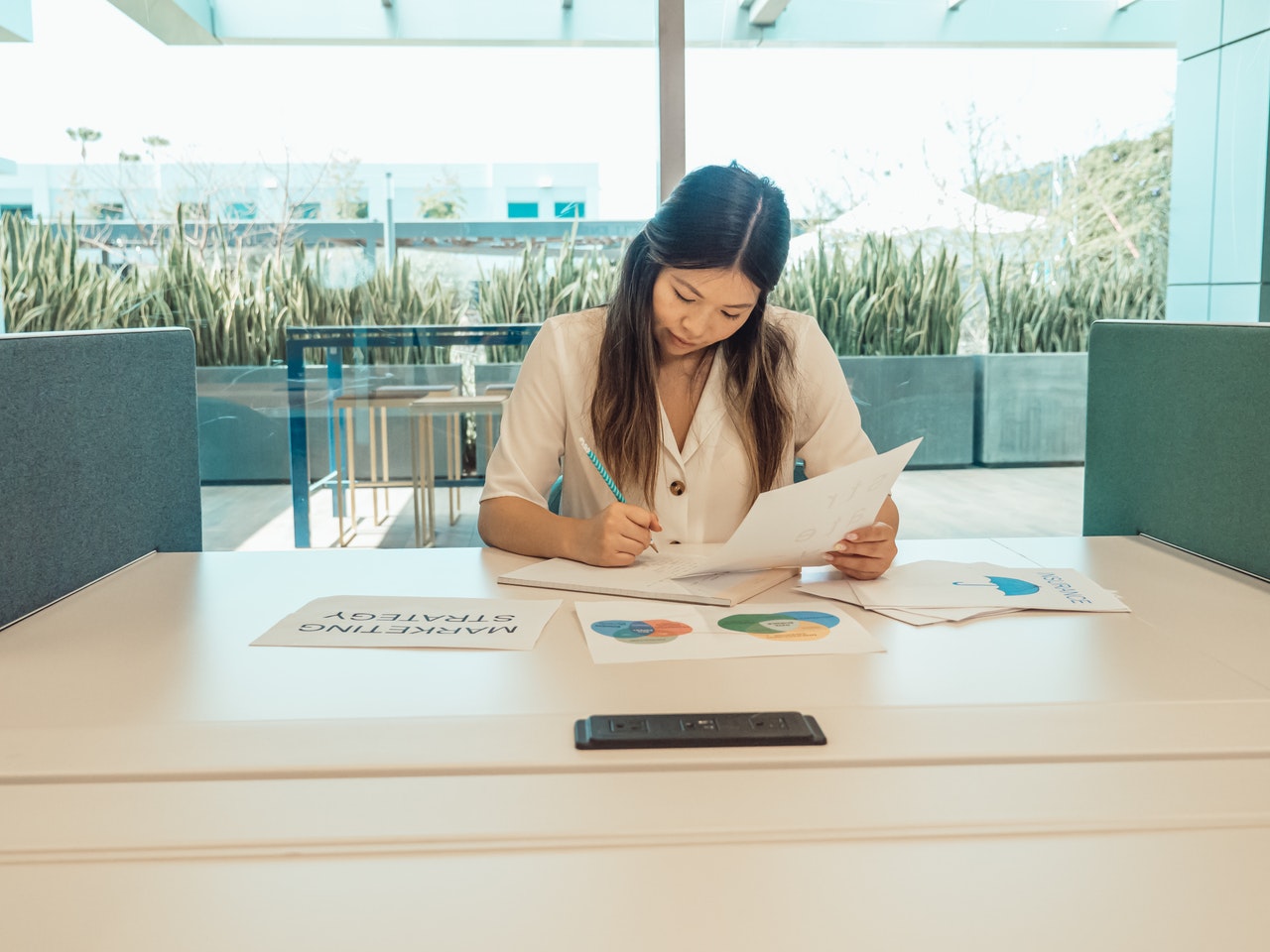 a woman documenting a business flow