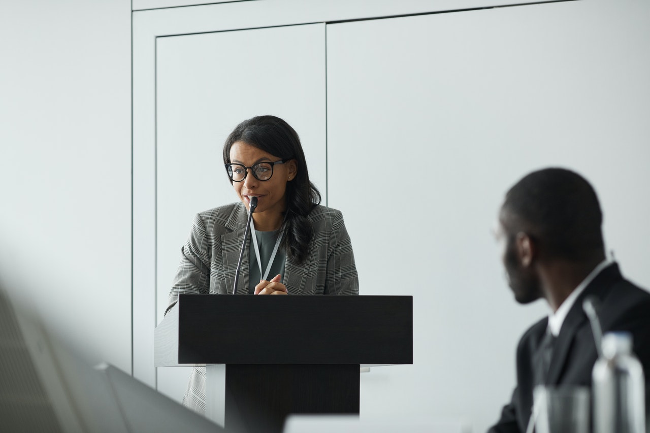 a lady speaking at an event