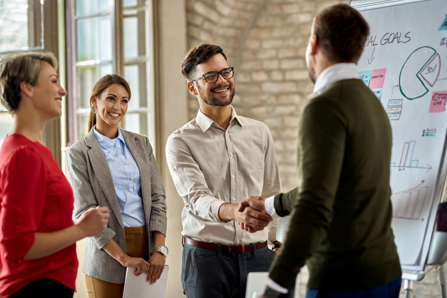 shaking hands after a good business presentation