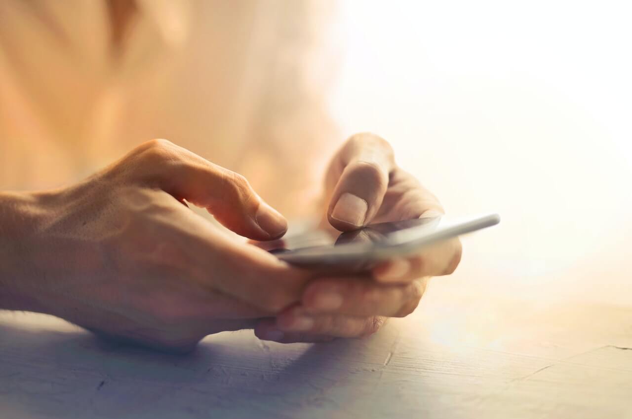 person-working-with-his-cell-phone