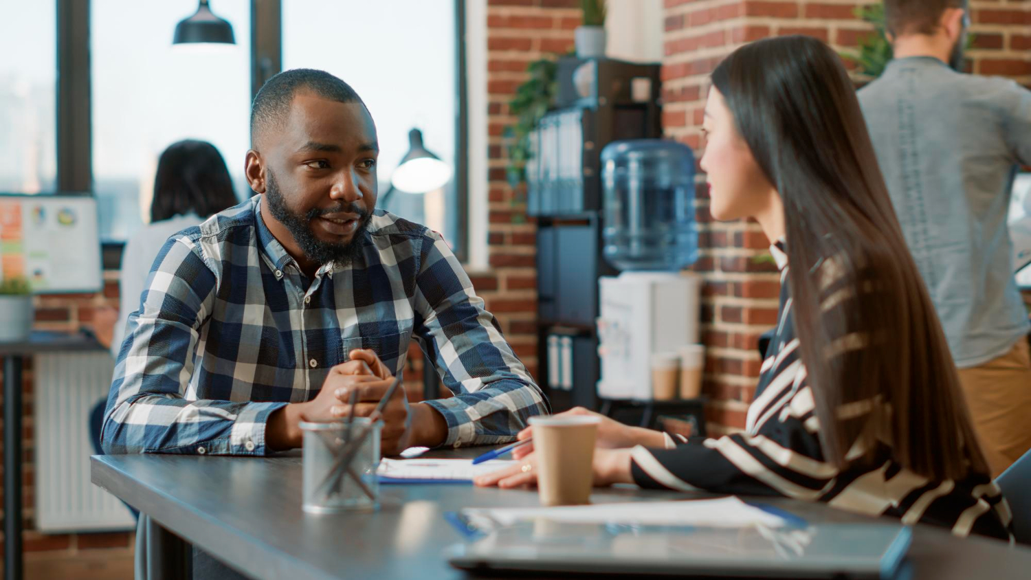 a lady having a conversation with a young man