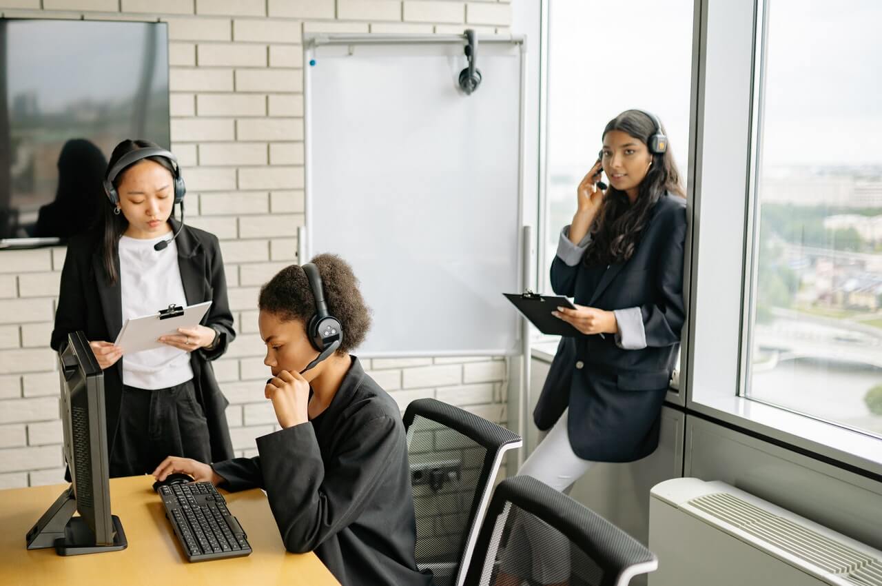 women-wearing-headsets-in-a-workplace