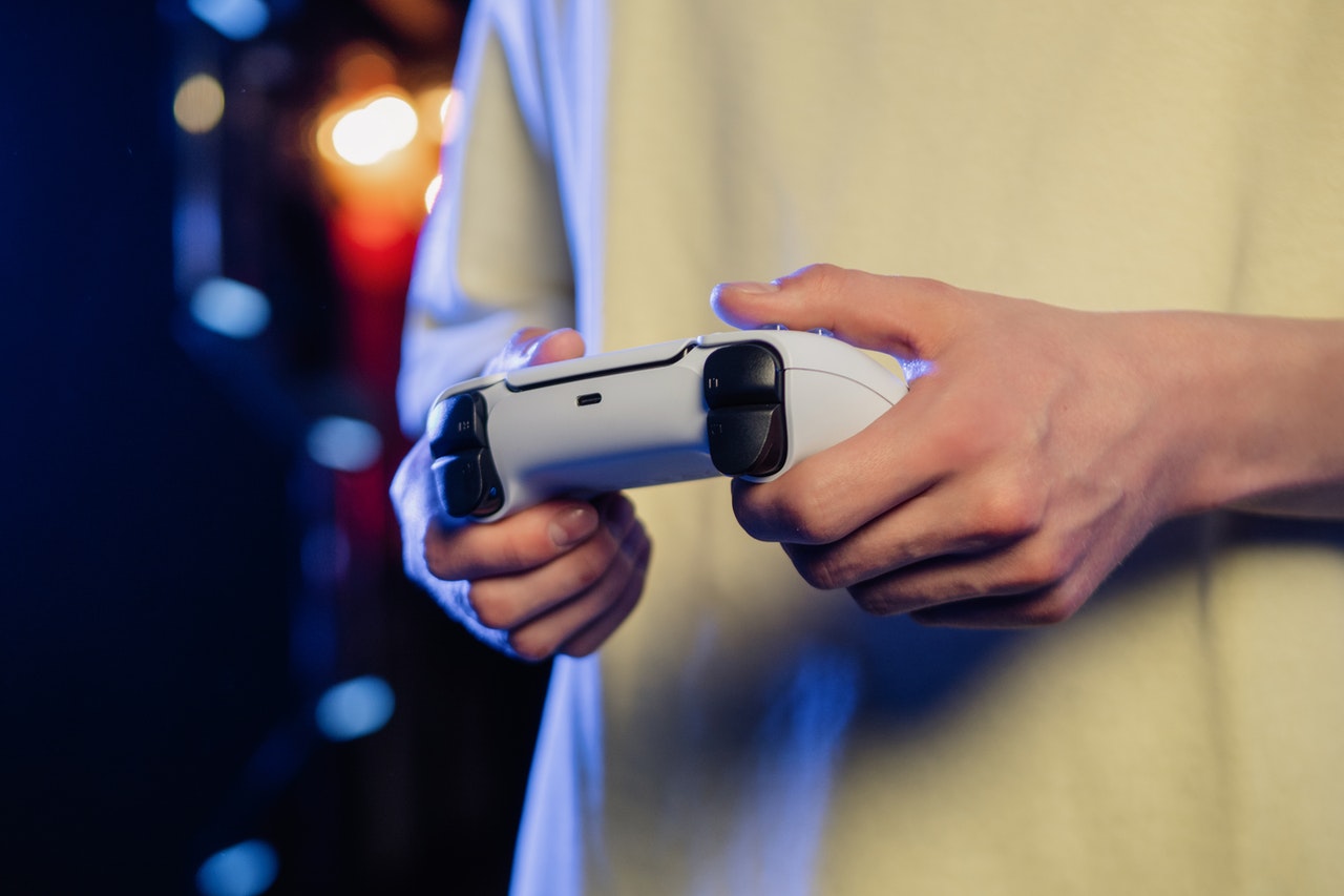 A person holding a game controller