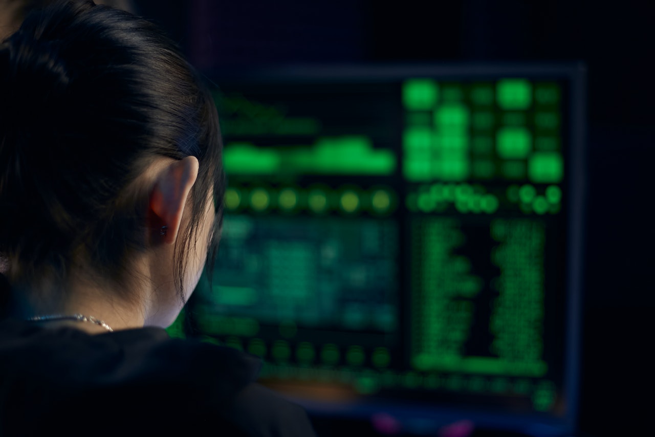 A-female-cyber-hacker-working-on-a-system