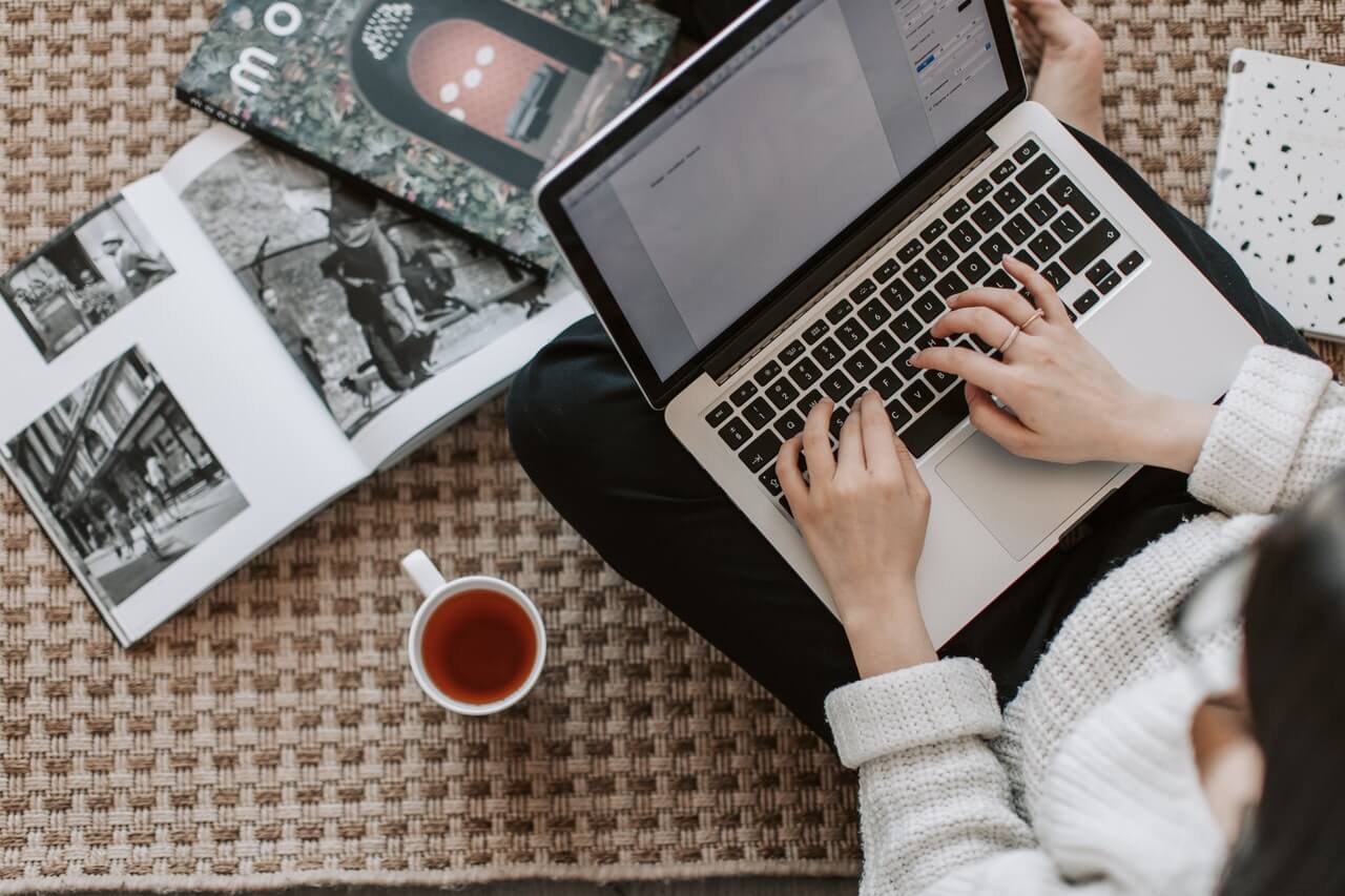 A lady working on laptop creating content