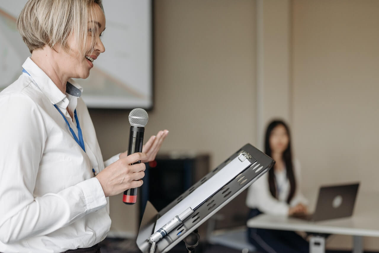 A lady speaking at an event