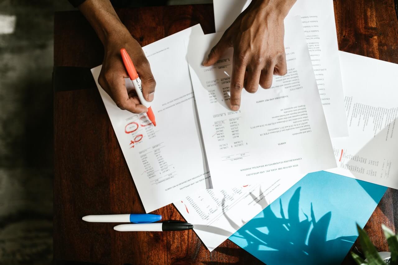 Businessman revising documents on the desk