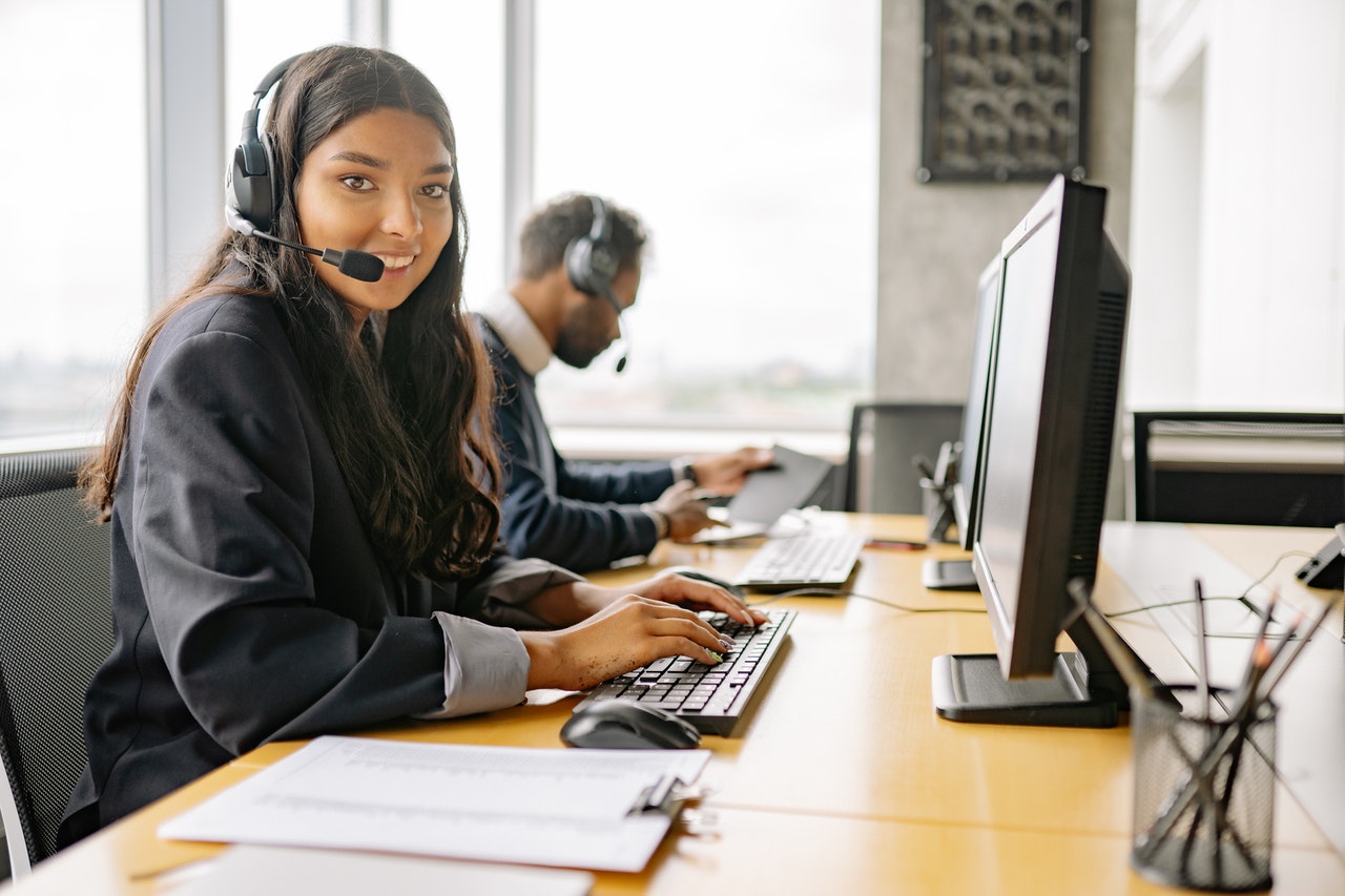 A smiling customer service lady working