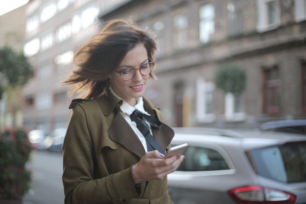 A-woman-satisfied-with-a-text-on-her-phone